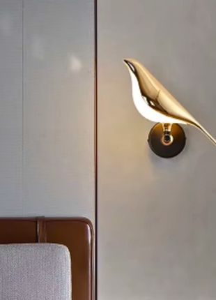 Zephyr Wing Wall Light – Sculptural Golden Bird Design.