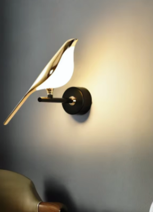 Zephyr Wing Wall Light – Sculptural Golden Bird Design.